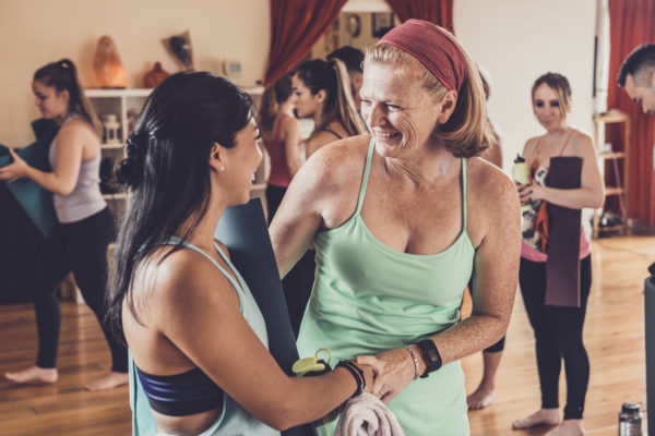 women sociallizing in Power Yoga Canada Studio